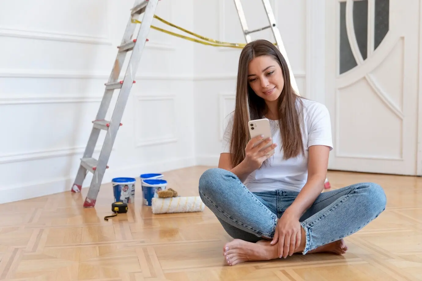 Full-length shot of a woman holding a smartphone.